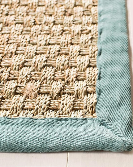 SAFAVIEH Area Rug 6x9 - Natural Fiber Collection - Natural & Light Blue, Seagrass, Basketweave Pattern with Border (NF114M)